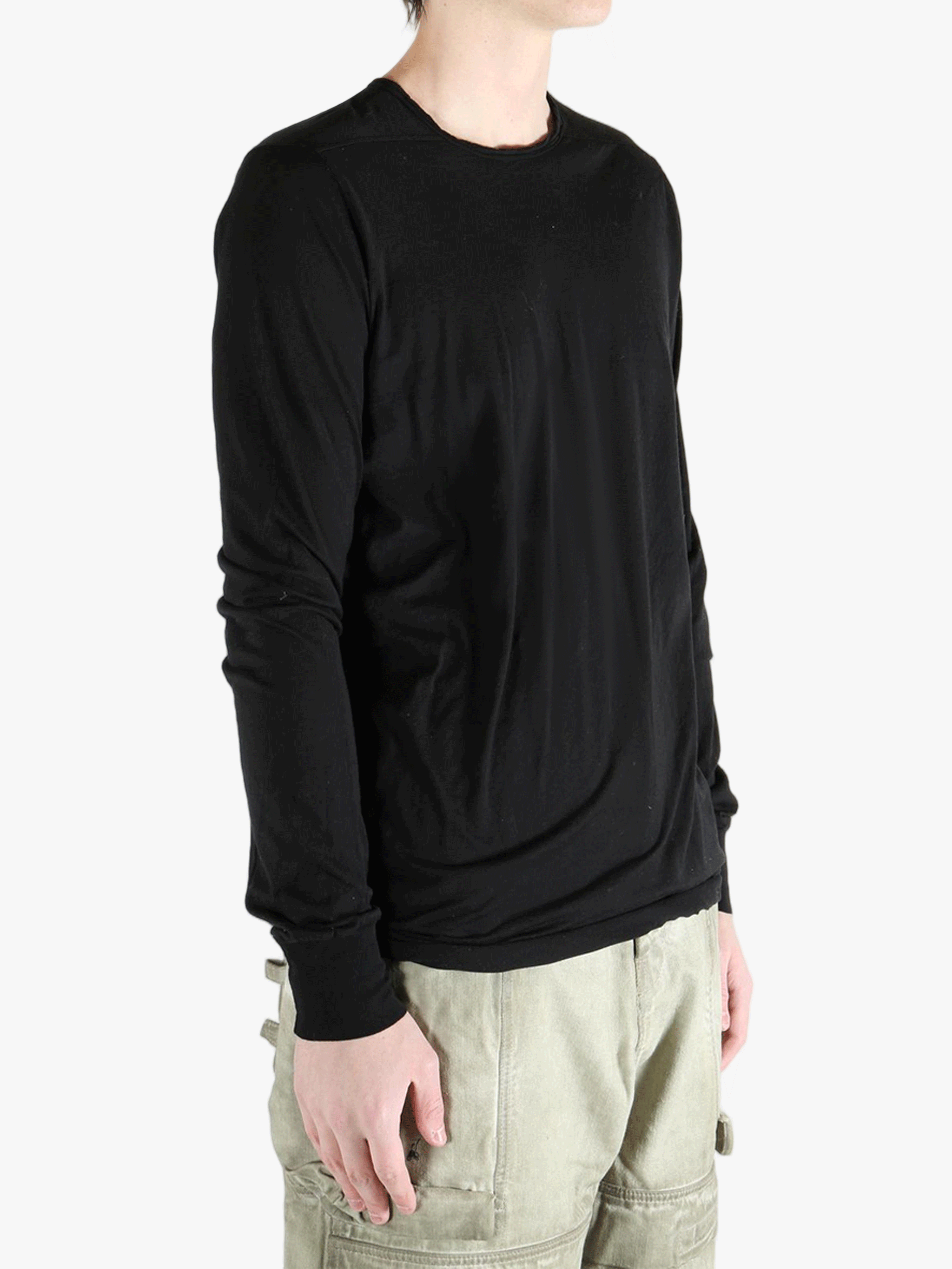 Black t-shirt worn by a person, showing the t-shirt fit