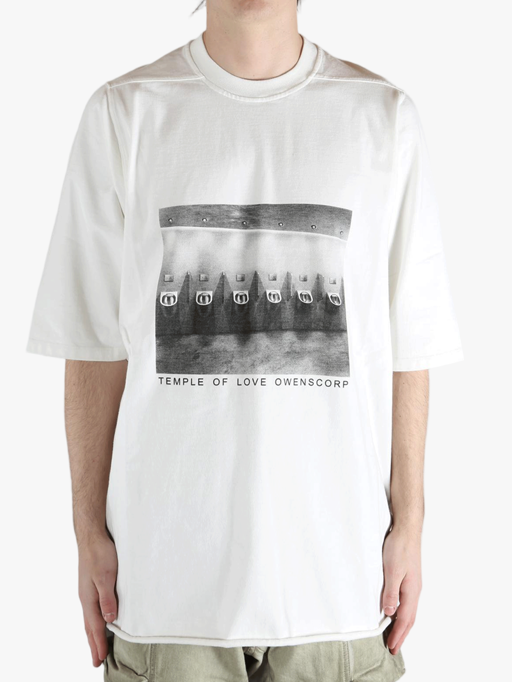 White t-shirt worn by a person, showing the t-shirt fit