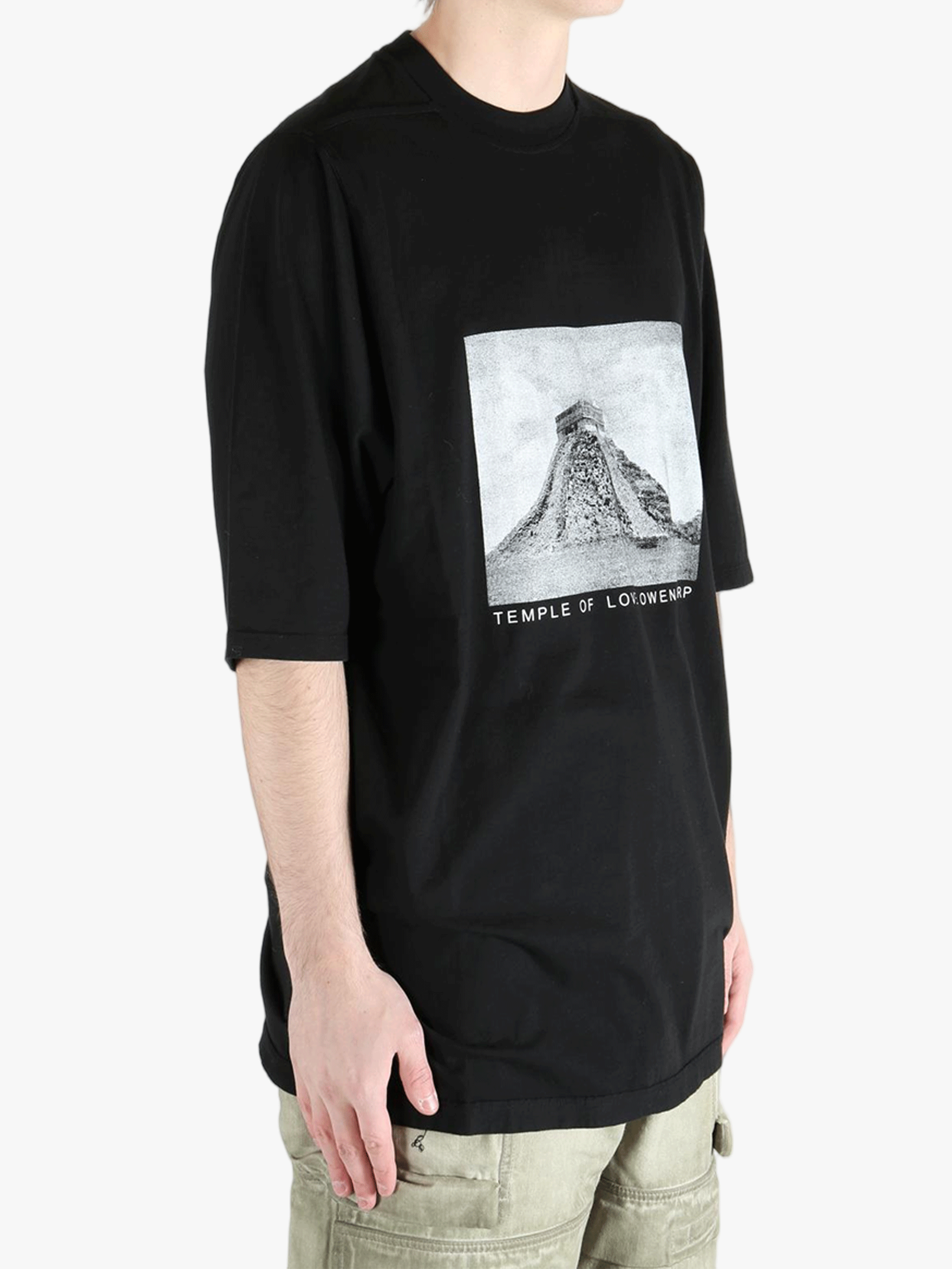 Black t-shirt worn by a person, showing the t-shirt fit