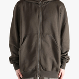 Brown hoodie worn by a person, showing the hoodie's fit