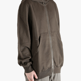 Brown hoodie worn by a person, showing the hoodie's fit