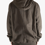 Brown hoodie worn by a person, showing the hoodie's fit