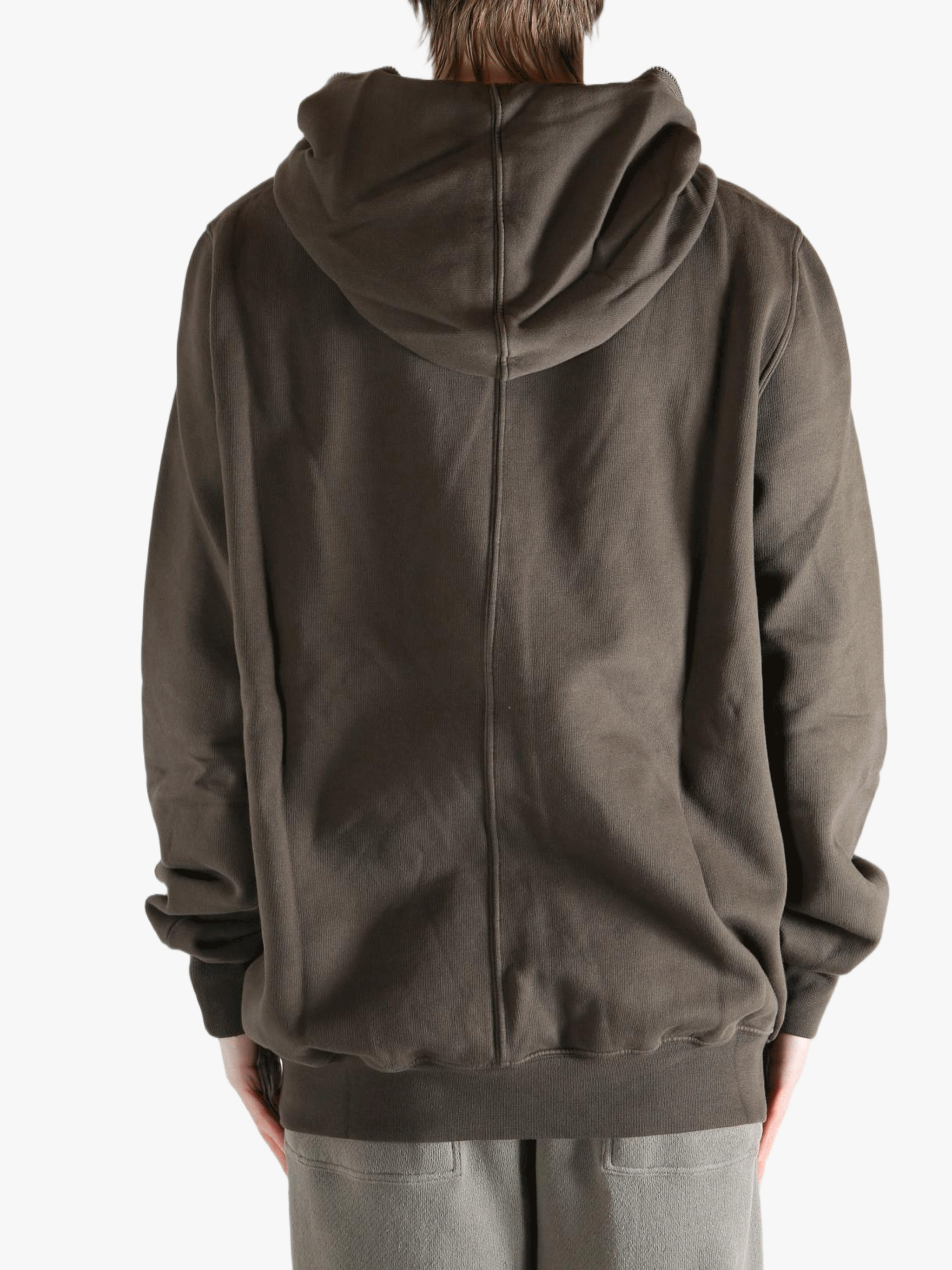 Brown hoodie worn by a person, showing the hoodie's fit
