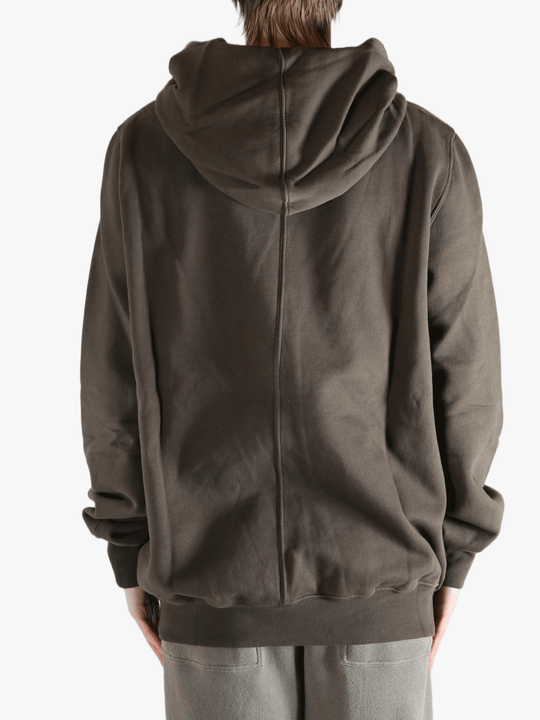 Brown hoodie worn by a person, showing the hoodie's fit