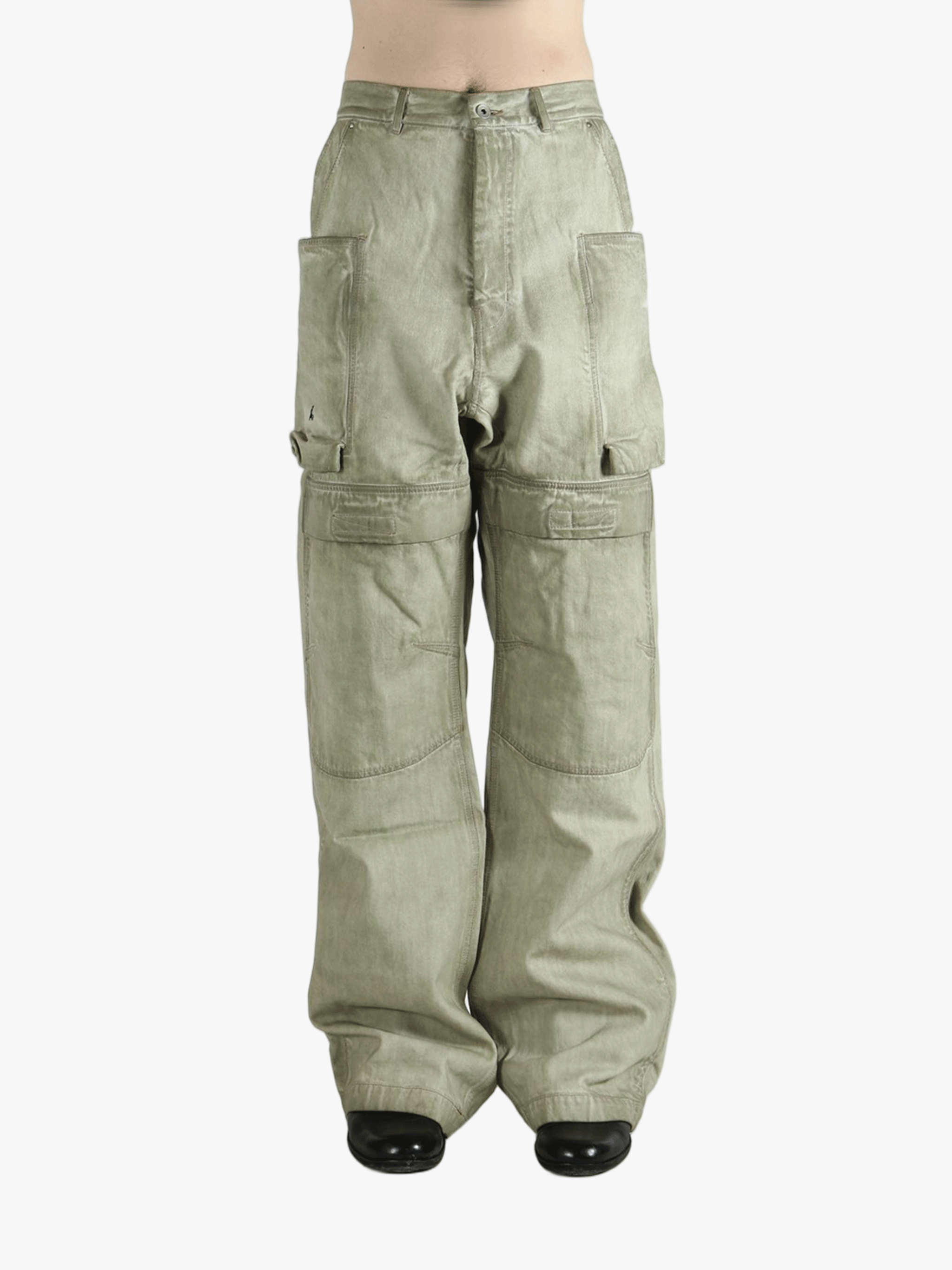 Green pants worn by a person, showing the pants fit