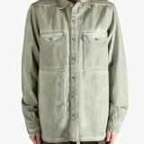 Green shirt worn by a person, showing the shirt's fit