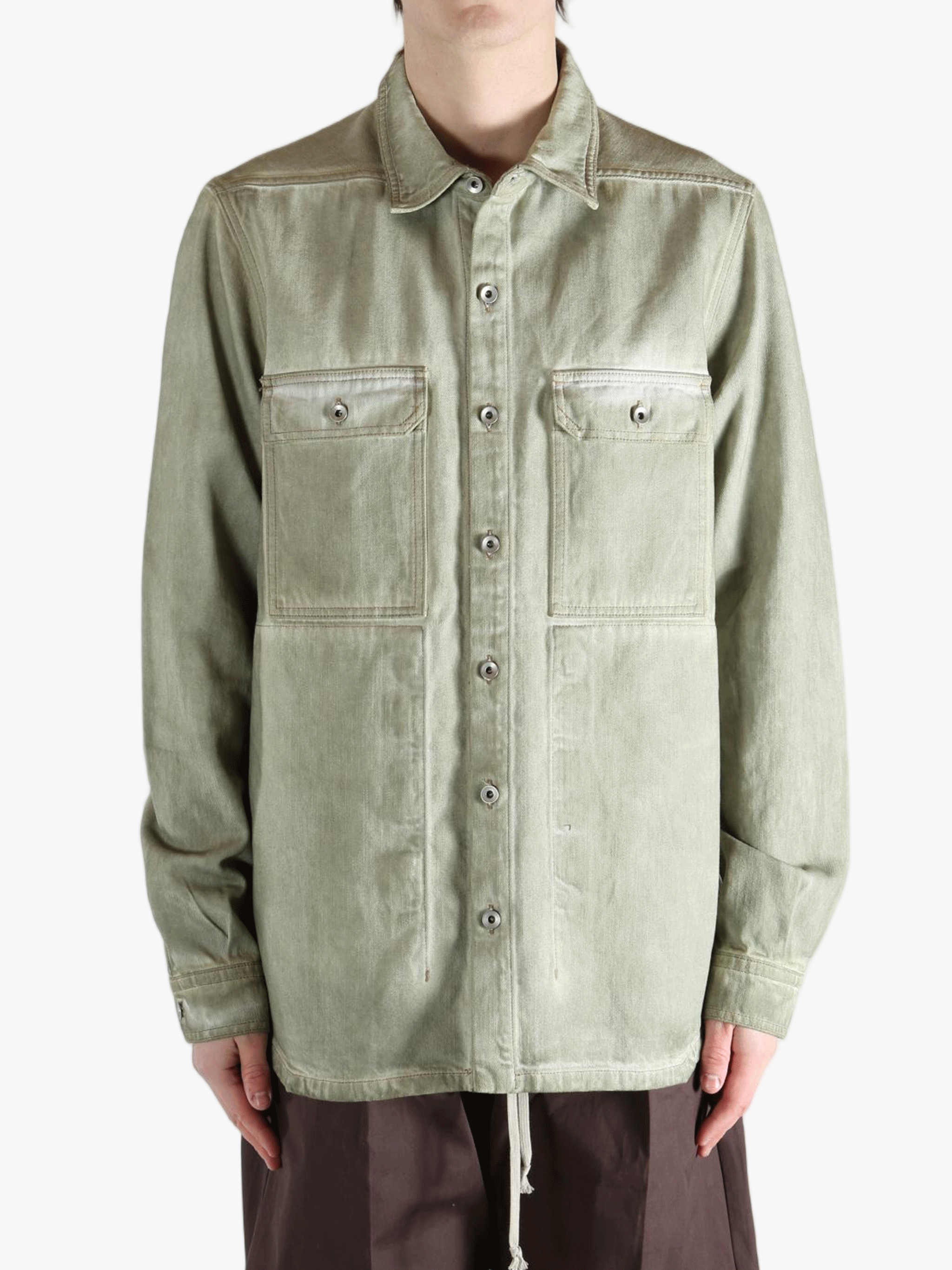 Green shirt worn by a person, showing the shirt's fit