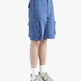 Blue shorts worn by a person,showing texture of the cotton fabric.