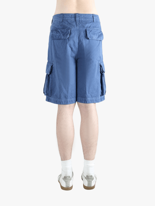Blue cargo shorts worn by a person,showing texture of the cotton fabric.