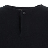 Close up of black sweater,showing texture of the wool fabric