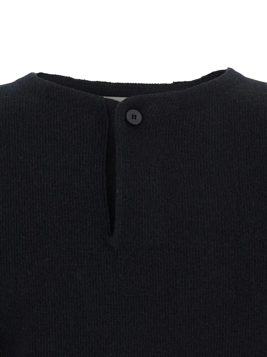 Close up of black sweater,showing texture of the wool fabric