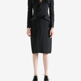 black dress worn by a person, showing the dress fit