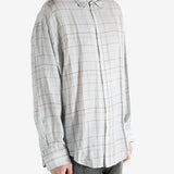 Grey shirt worn by a person, showing the shirt's fit