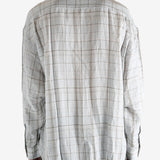 Grey shirt worn by a person, showing the shirt's fit