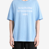 Blue t-shirt worn by a person, showing the t-shirt's fit