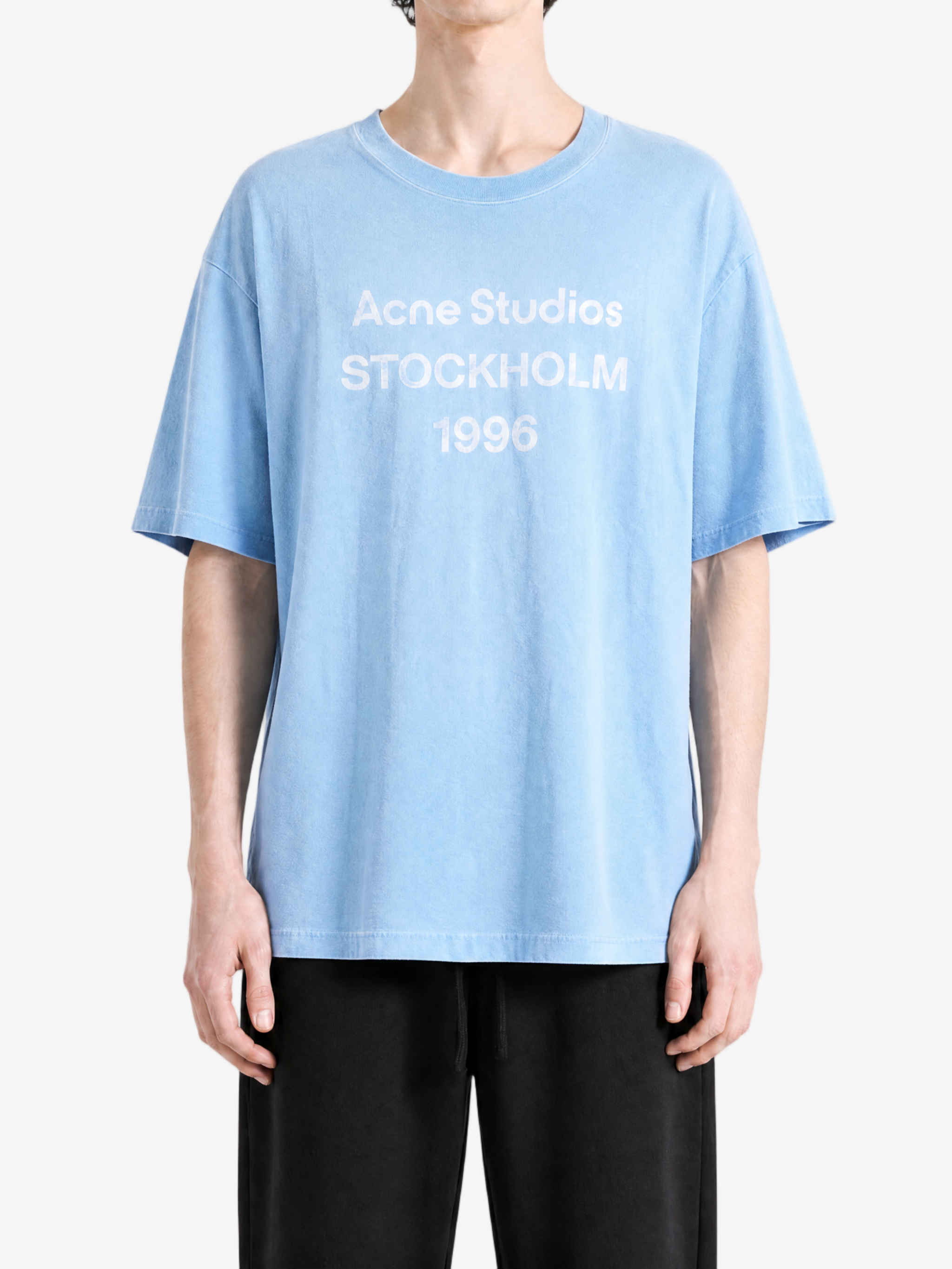 Blue t-shirt worn by a person, showing the t-shirt's fit