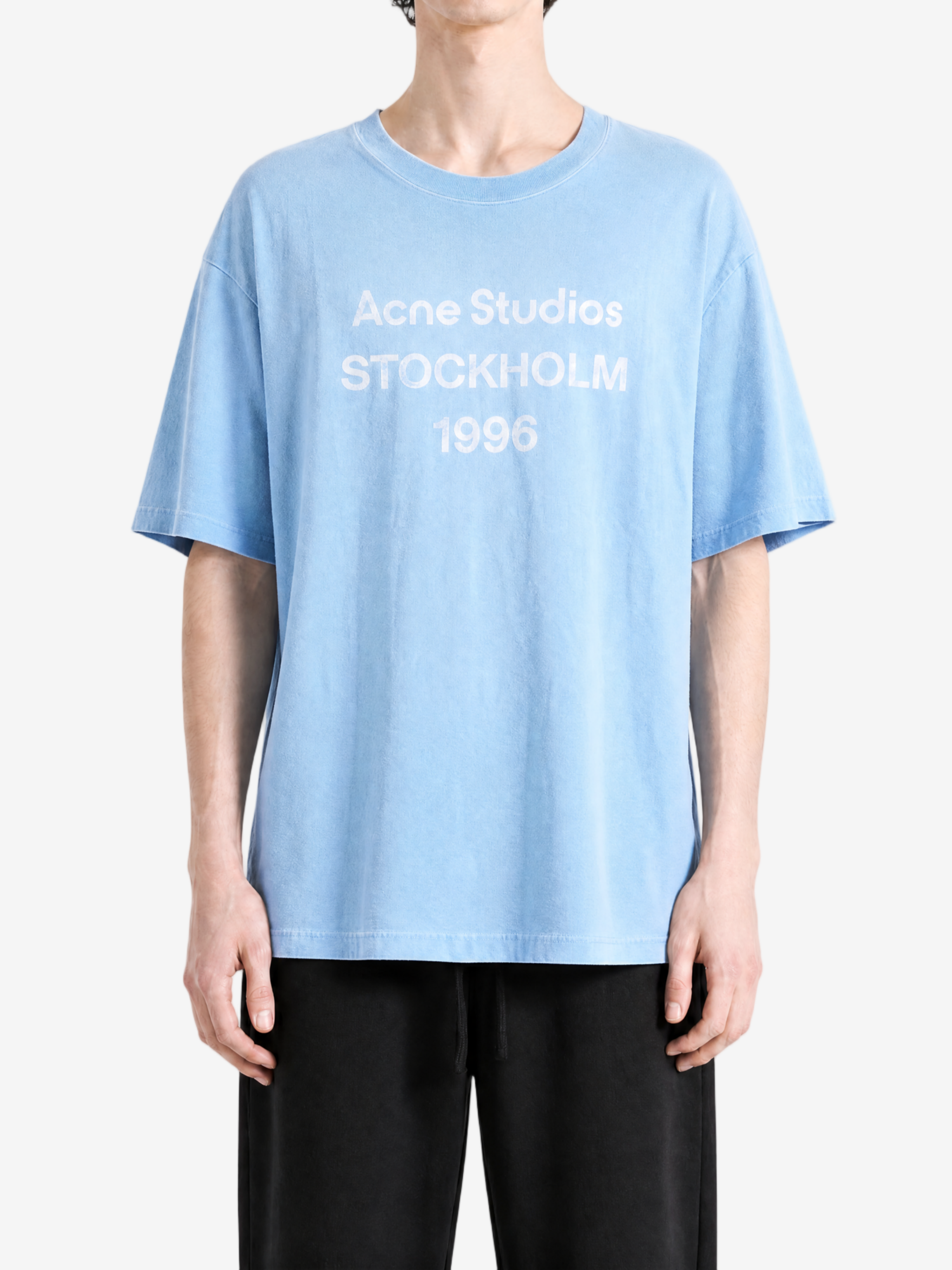 Blue t-shirt worn by a person, showing the t-shirt's fit
