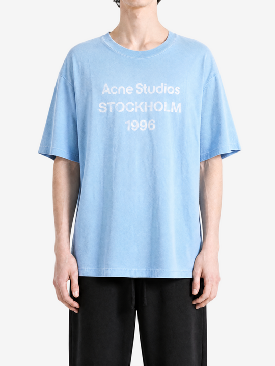 Blue t-shirt worn by a person, showing the t-shirt's fit