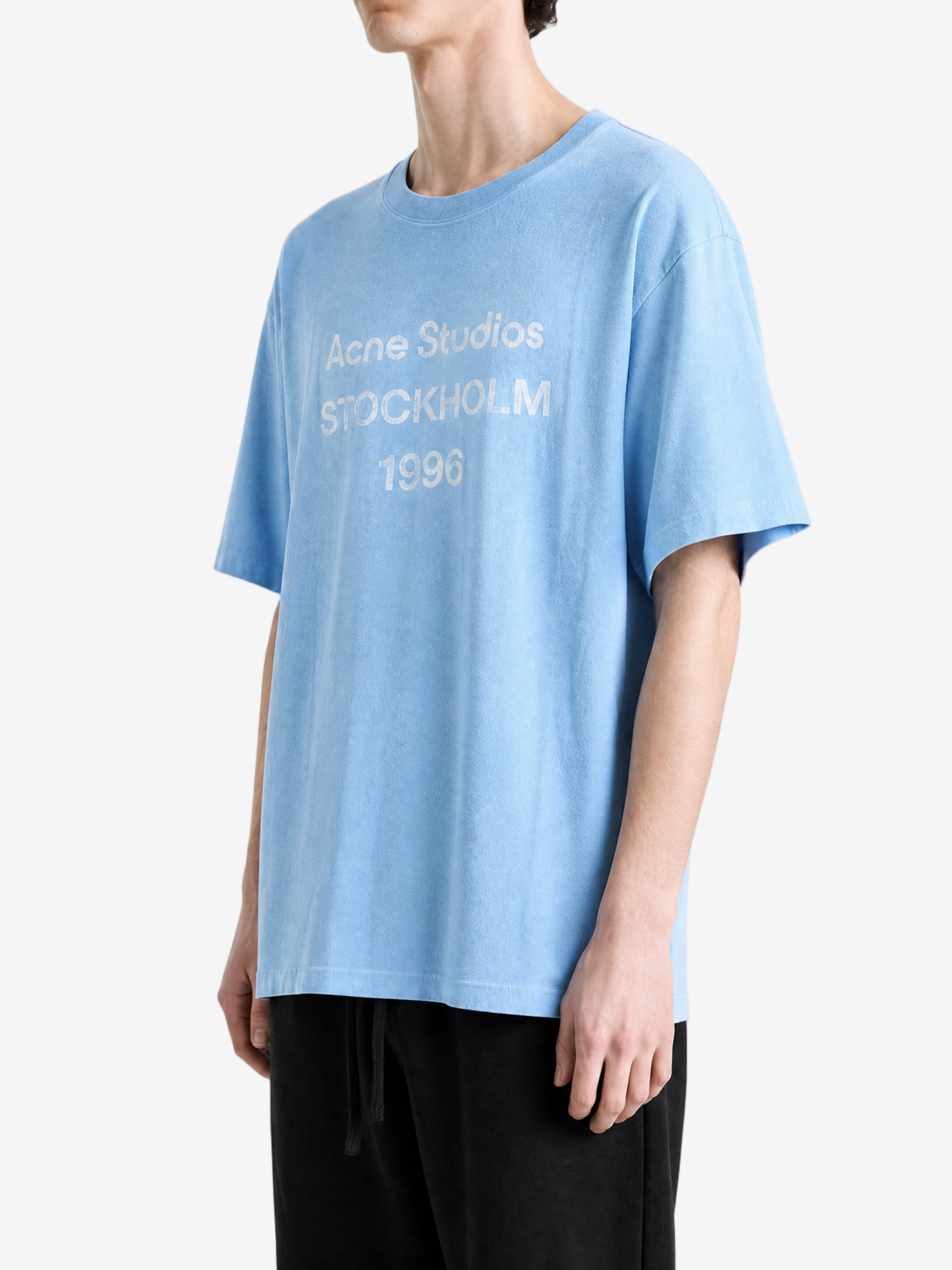 Blue t-shirt worn by a person, showing the t-shirt fit