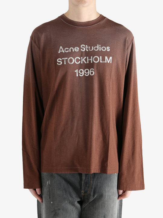 Brown shirt worn by a person, showing the shirt's fit