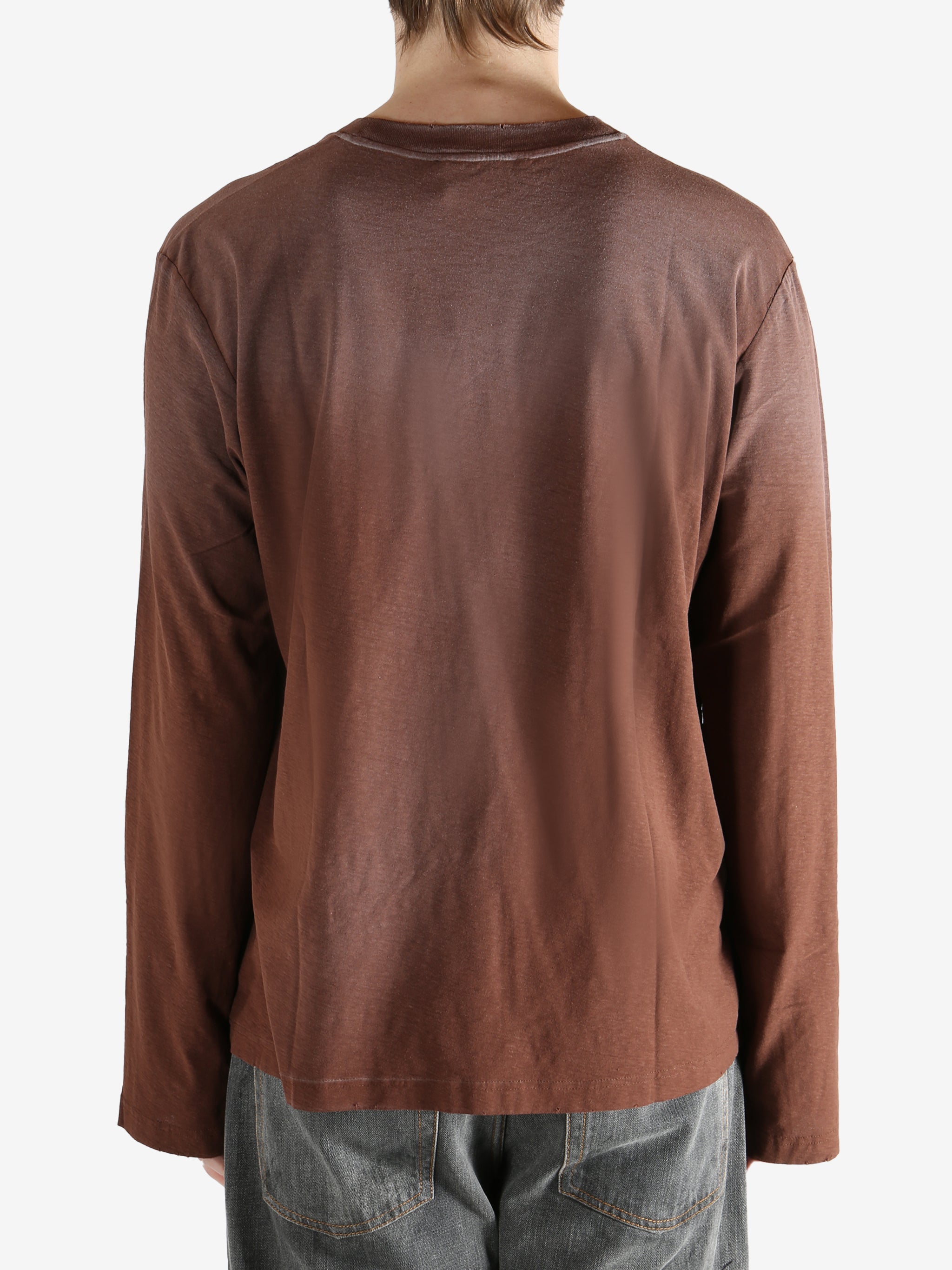 Brown shirt worn by a person, showing the shirt's fit