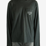 Black long-sleeve shirt worn by a person, showing the shirt fit