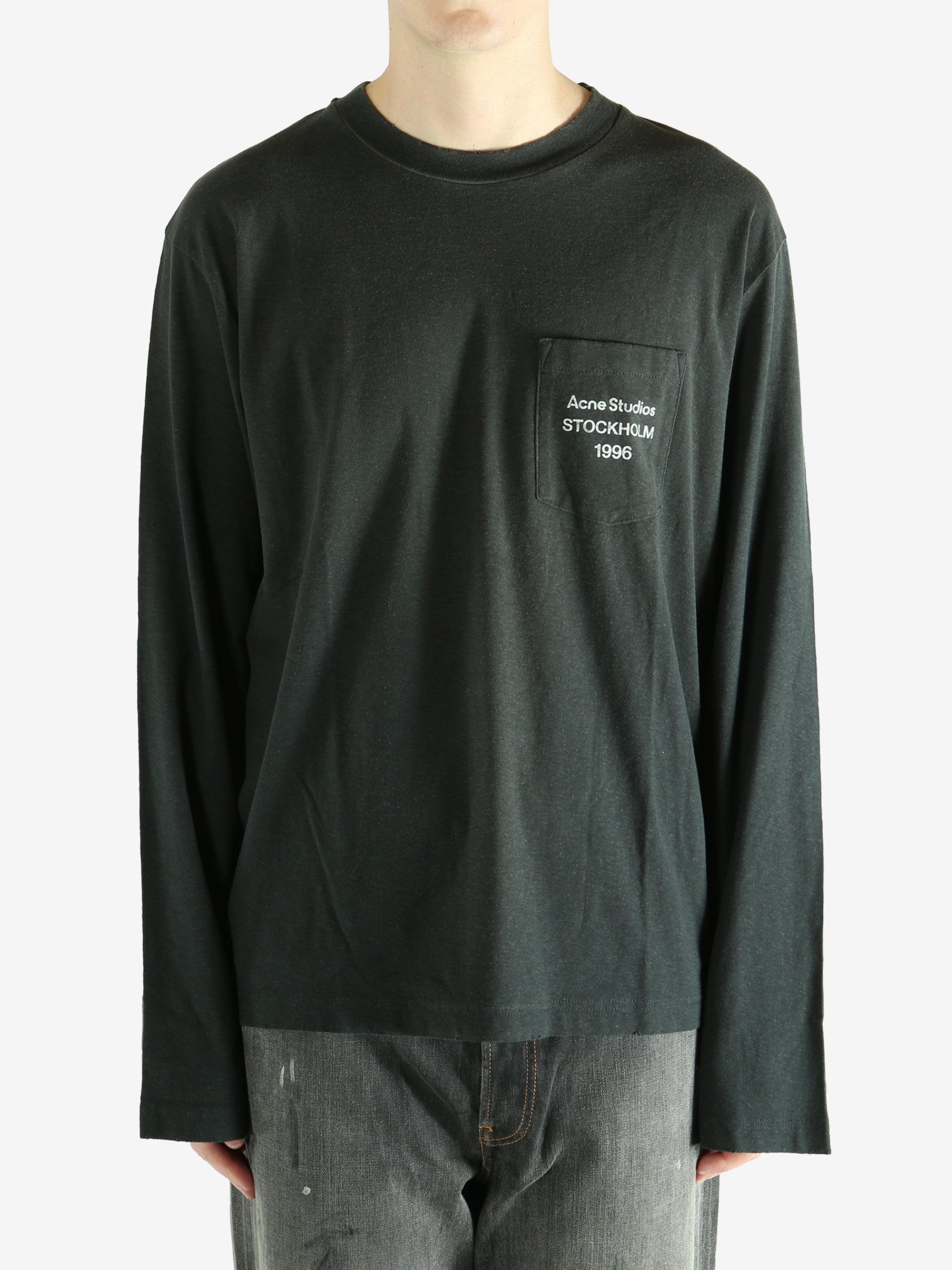 Black long-sleeve shirt worn by a person, showing the shirt fit