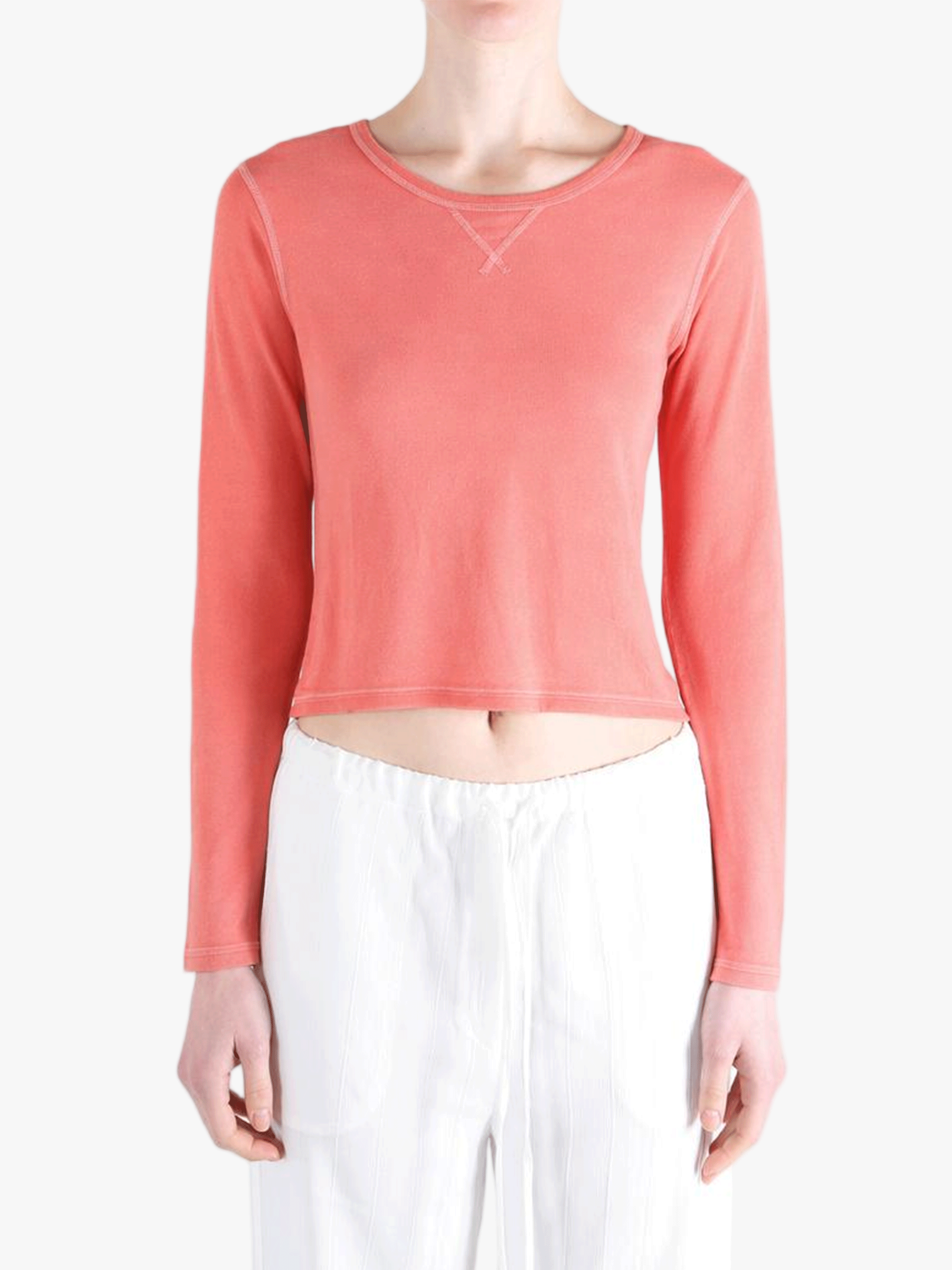 red tee worn by a person, showing the tee fit