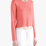 red tee worn by a person, showing the tee fit