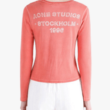 red tee worn by a person, showing the tee fit
