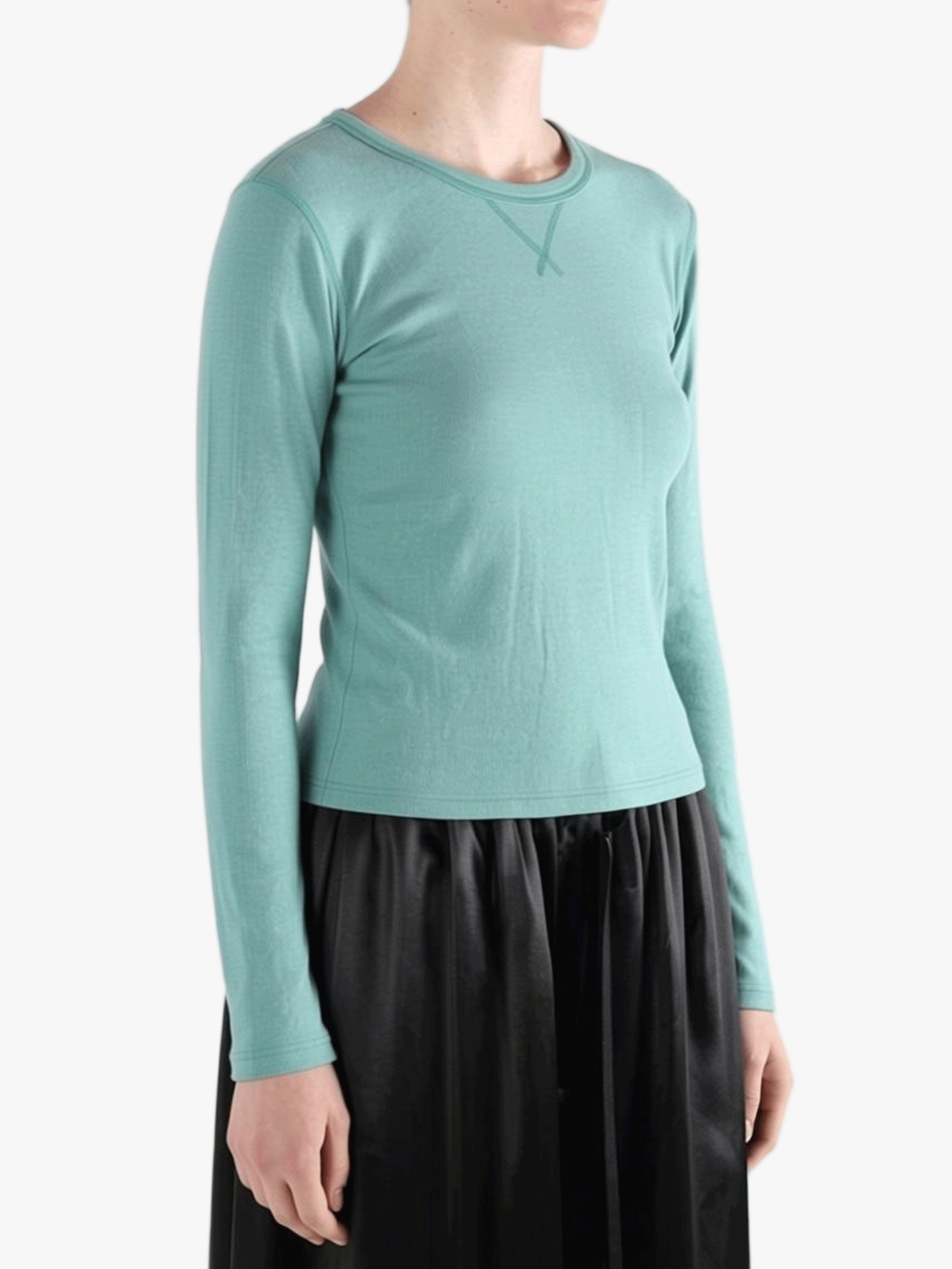 Green t-shirt worn by a person, side view