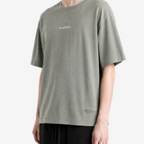 Green t-shirt worn by a person, showing the t-shirt fit