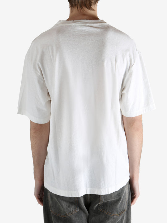 White t-shirt worn by a person, showing the shirt's fit