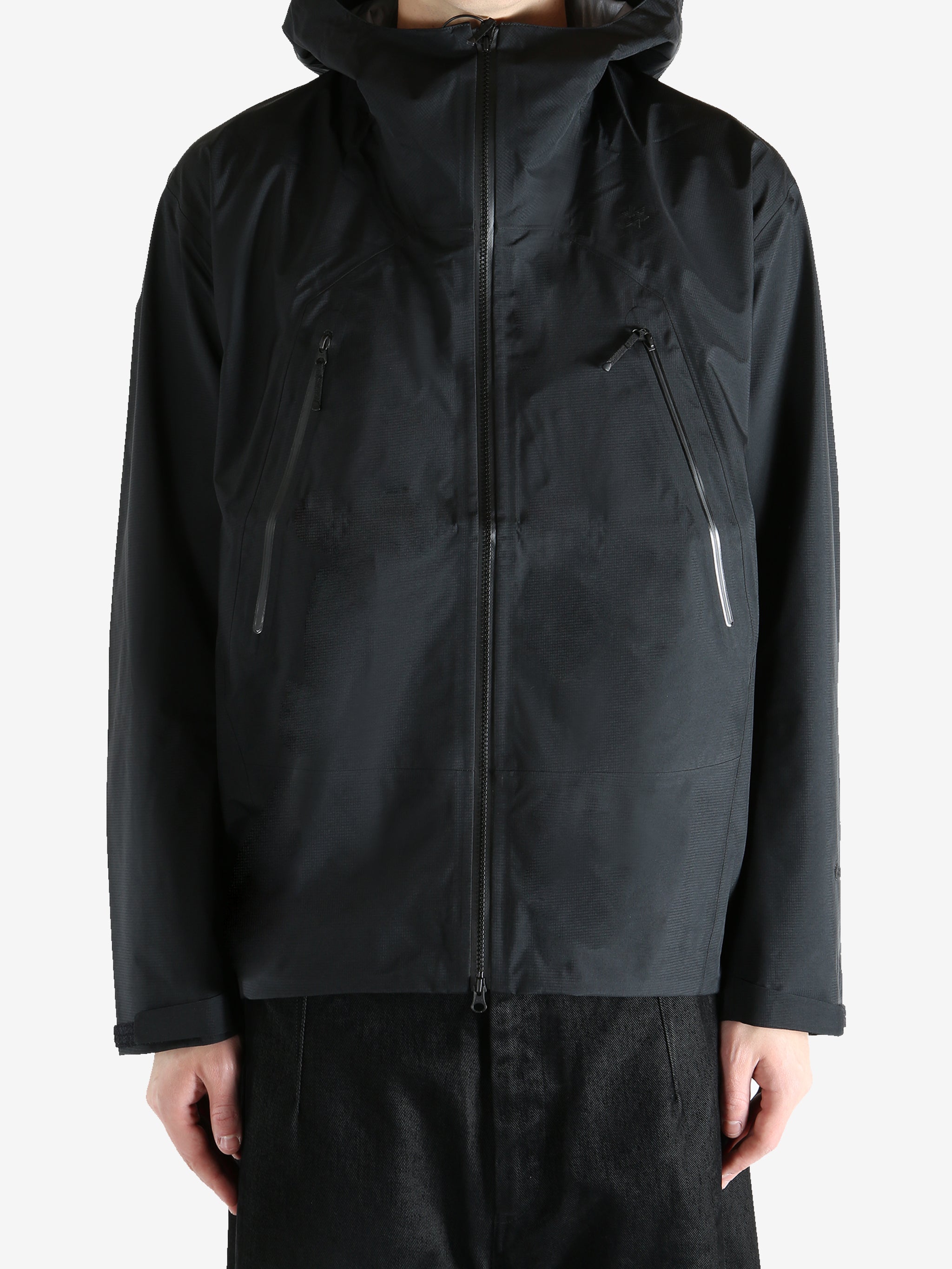 Black jacket worn by a person, showing the jacket fit