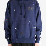 Navy hoodie worn by a person, showing the hoodie's fit