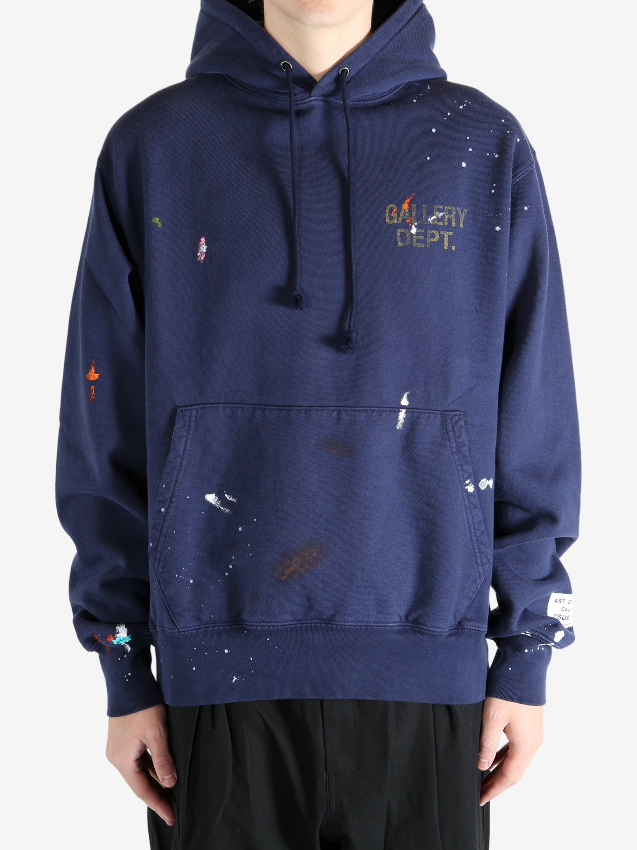 Navy hoodie worn by a person, showing the hoodie's fit