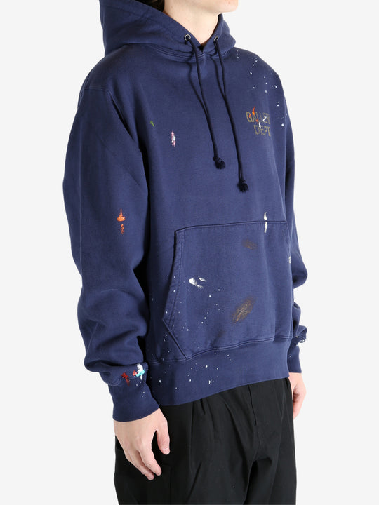 Navy hoodie worn by a person, showing the hoodie's fit