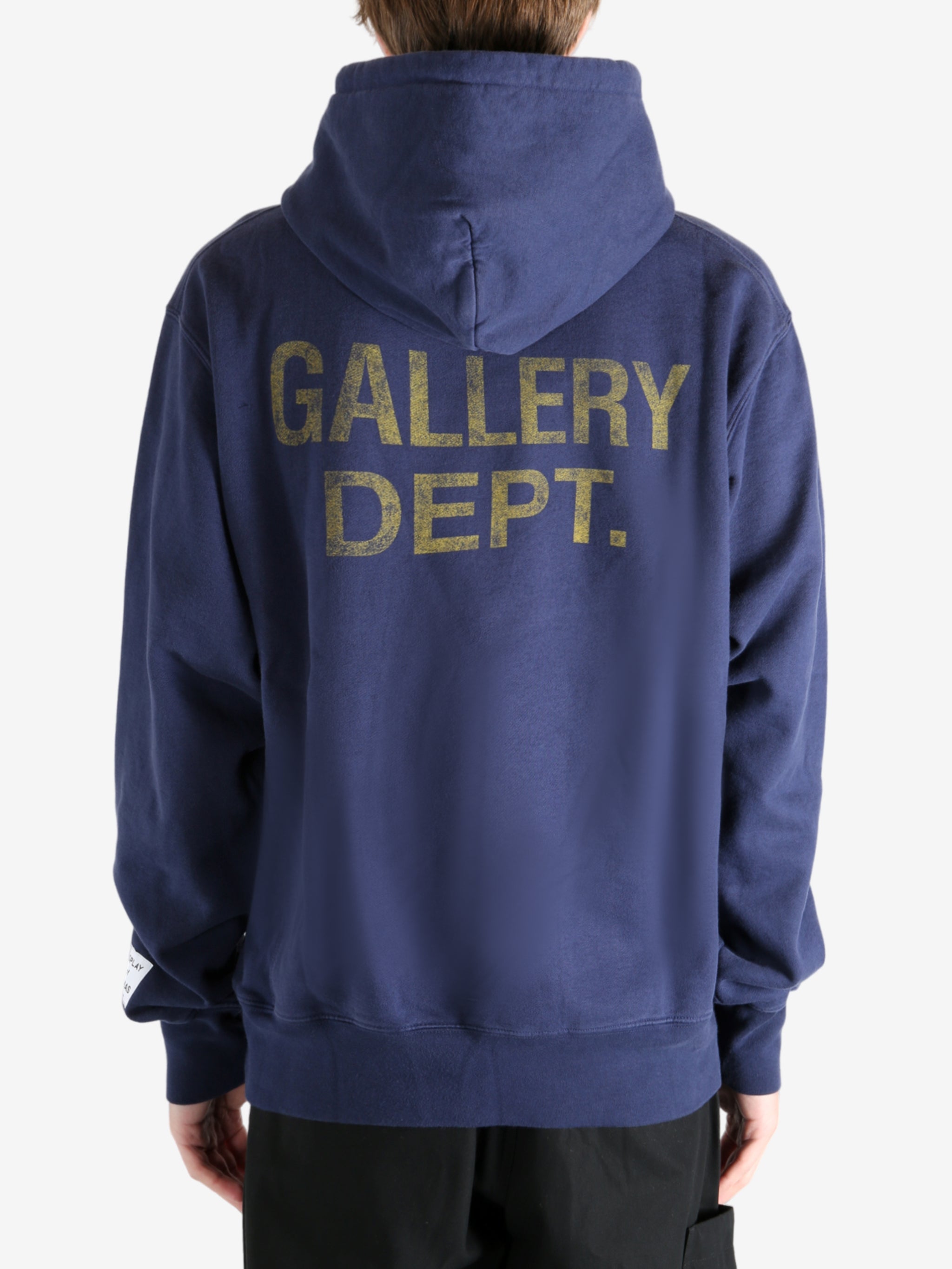 Navy hoodie worn by a person, showing the hoodie's fit