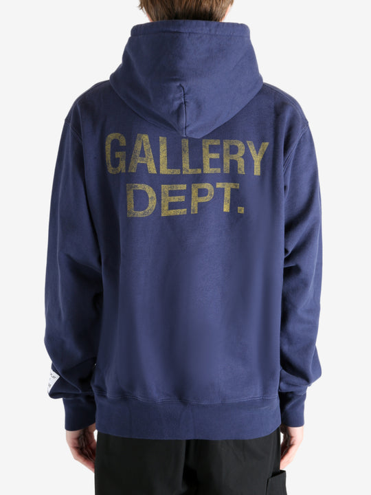 Navy hoodie worn by a person, showing the hoodie's fit