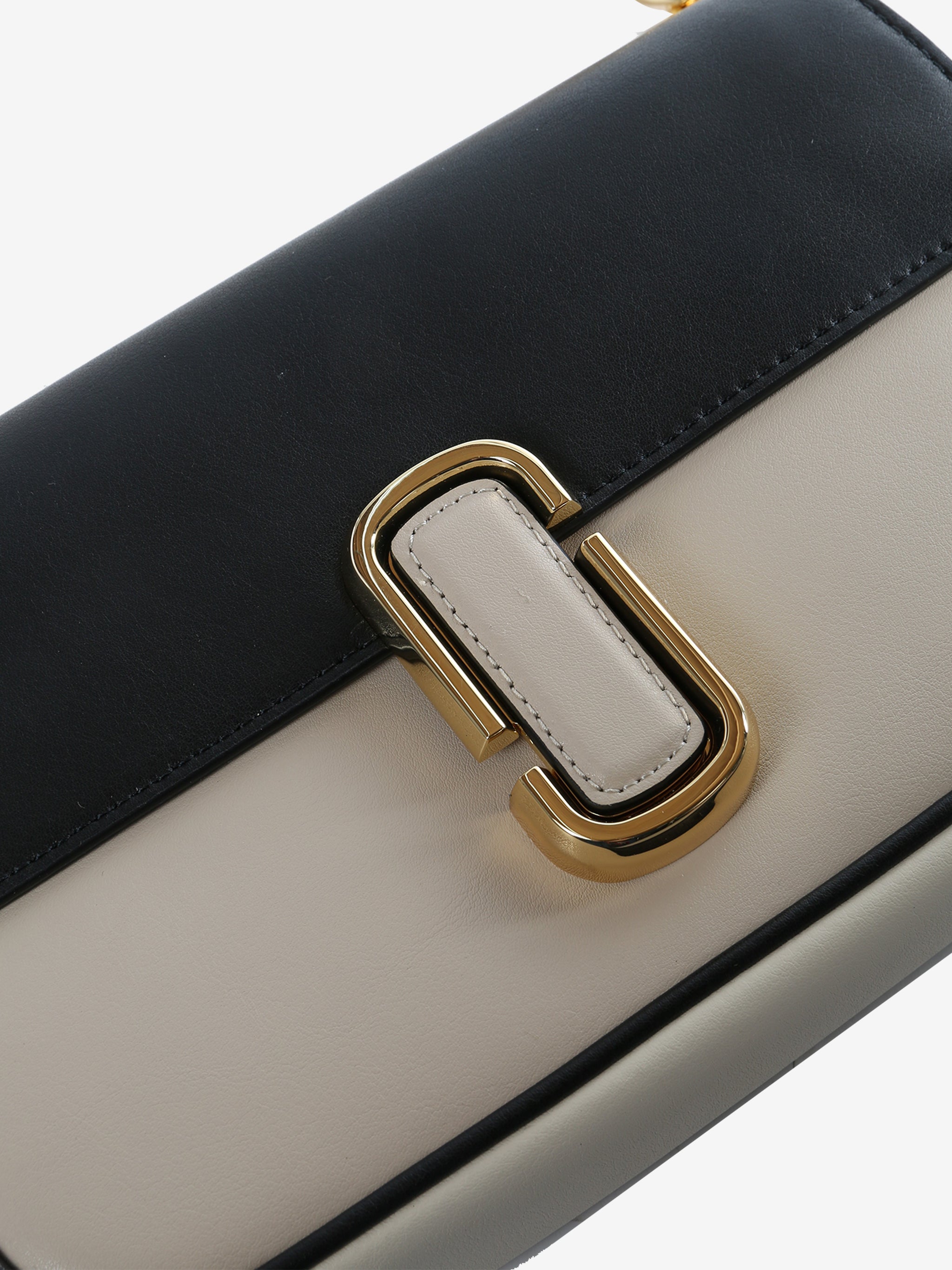 Close up of pink bag, showing the detail and the texture of cow leather