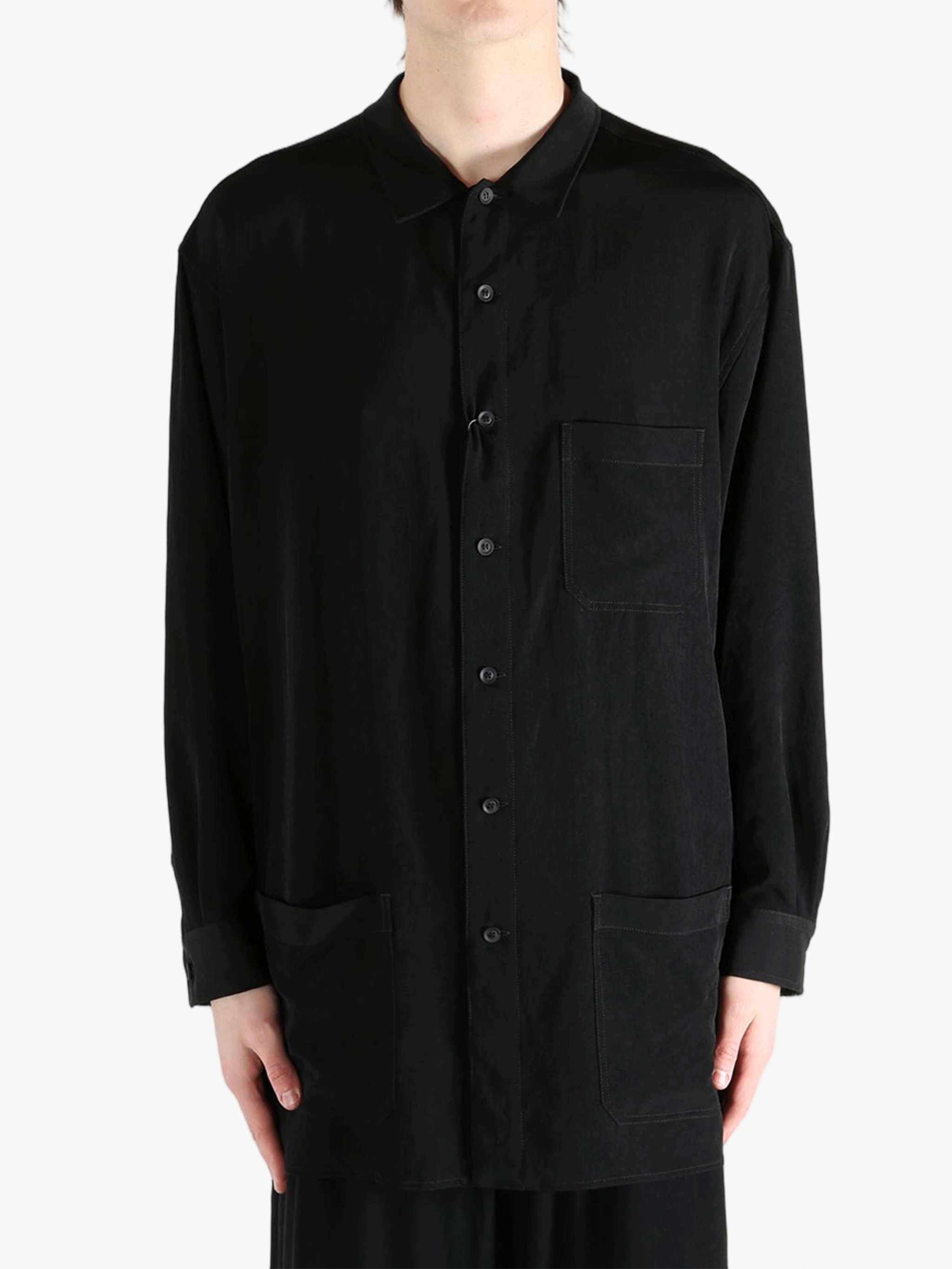 Black jacket worn by a person, showing the jacket's fit