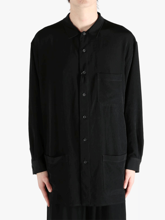 Black jacket worn by a person, showing the jacket's fit