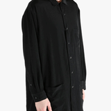 Black jacket worn by a person, showing the jacket's fit