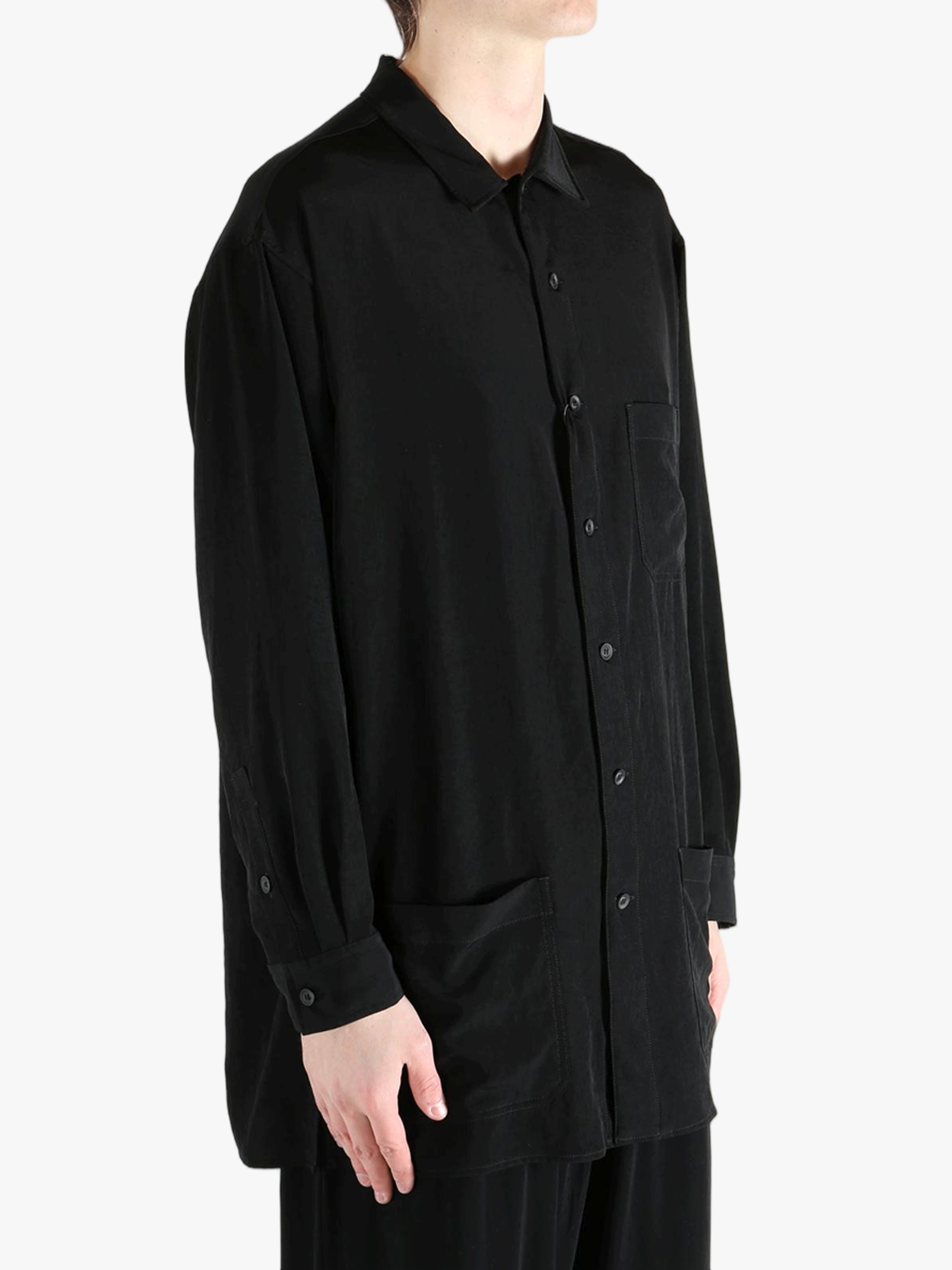 Black jacket worn by a person, showing the jacket's fit