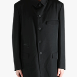 Black jacket worn by a person, showing the jacket's fit