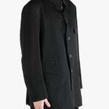 Black jacket worn by a person, showing the jacket's fit