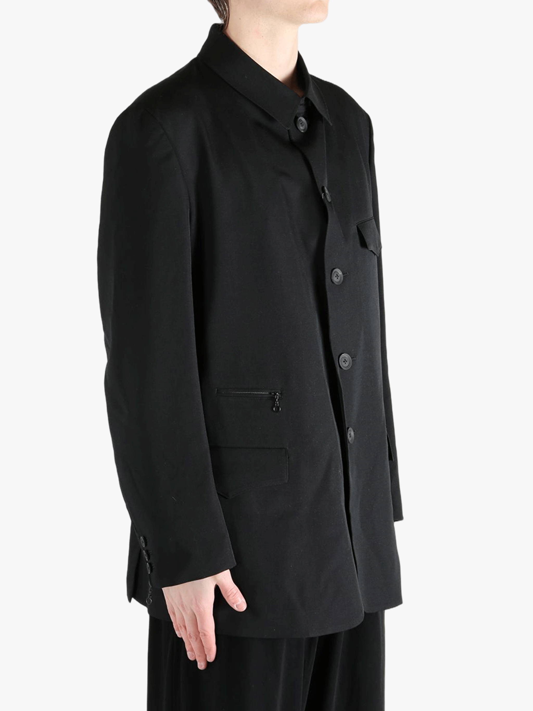 Black jacket worn by a person, showing the jacket's fit