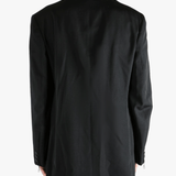 Black jacket worn by a person, showing the jacket's fit