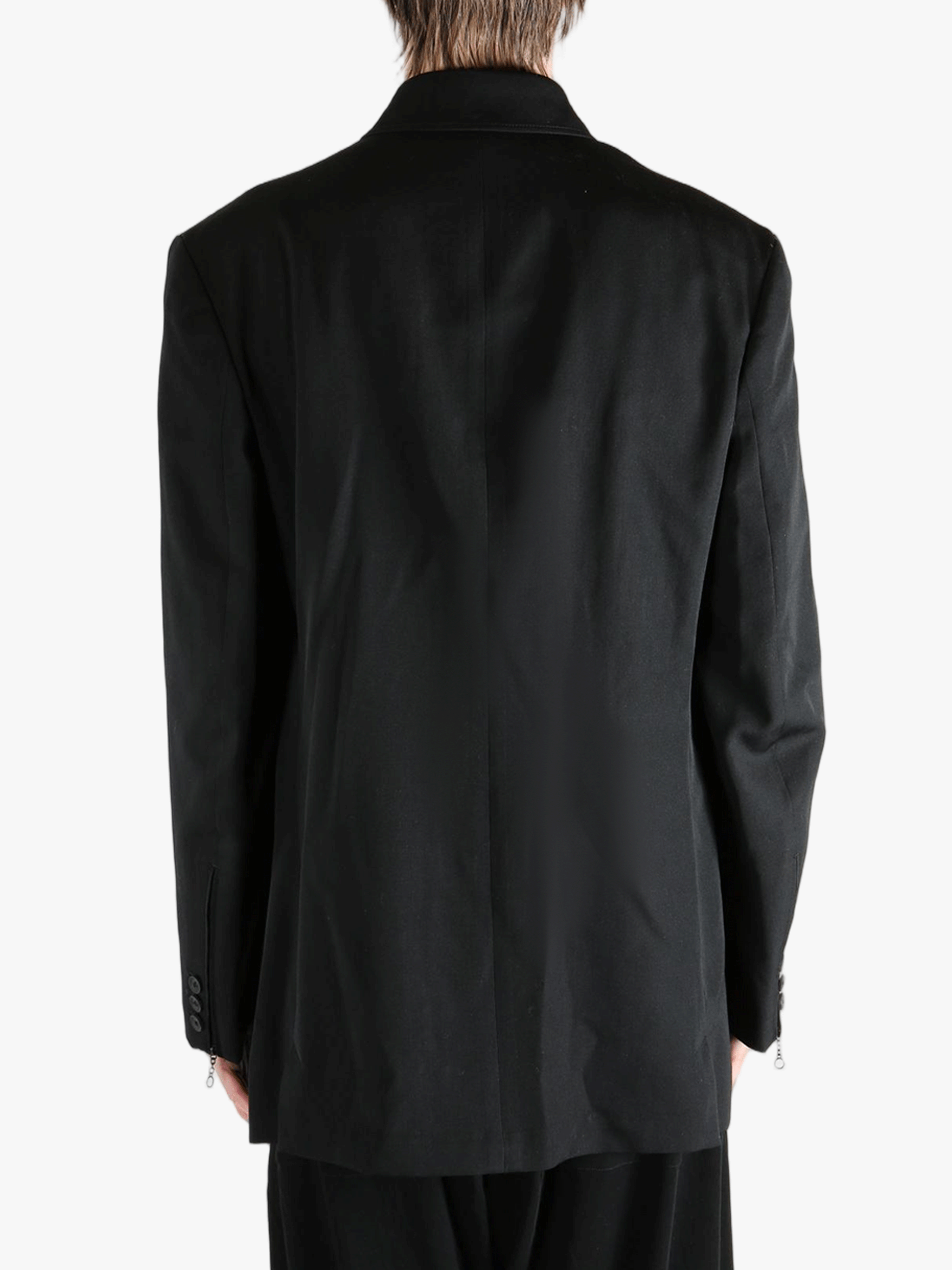 Black jacket worn by a person, showing the jacket's fit