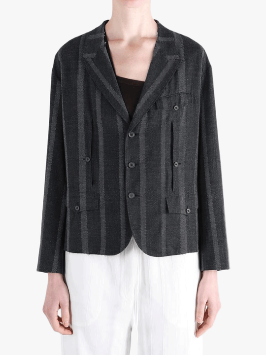 Black jacket-coat worn by a person, showing the jacket-coat's fit